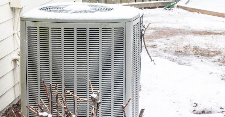 Balanced Comfort technician repairing a heating system
