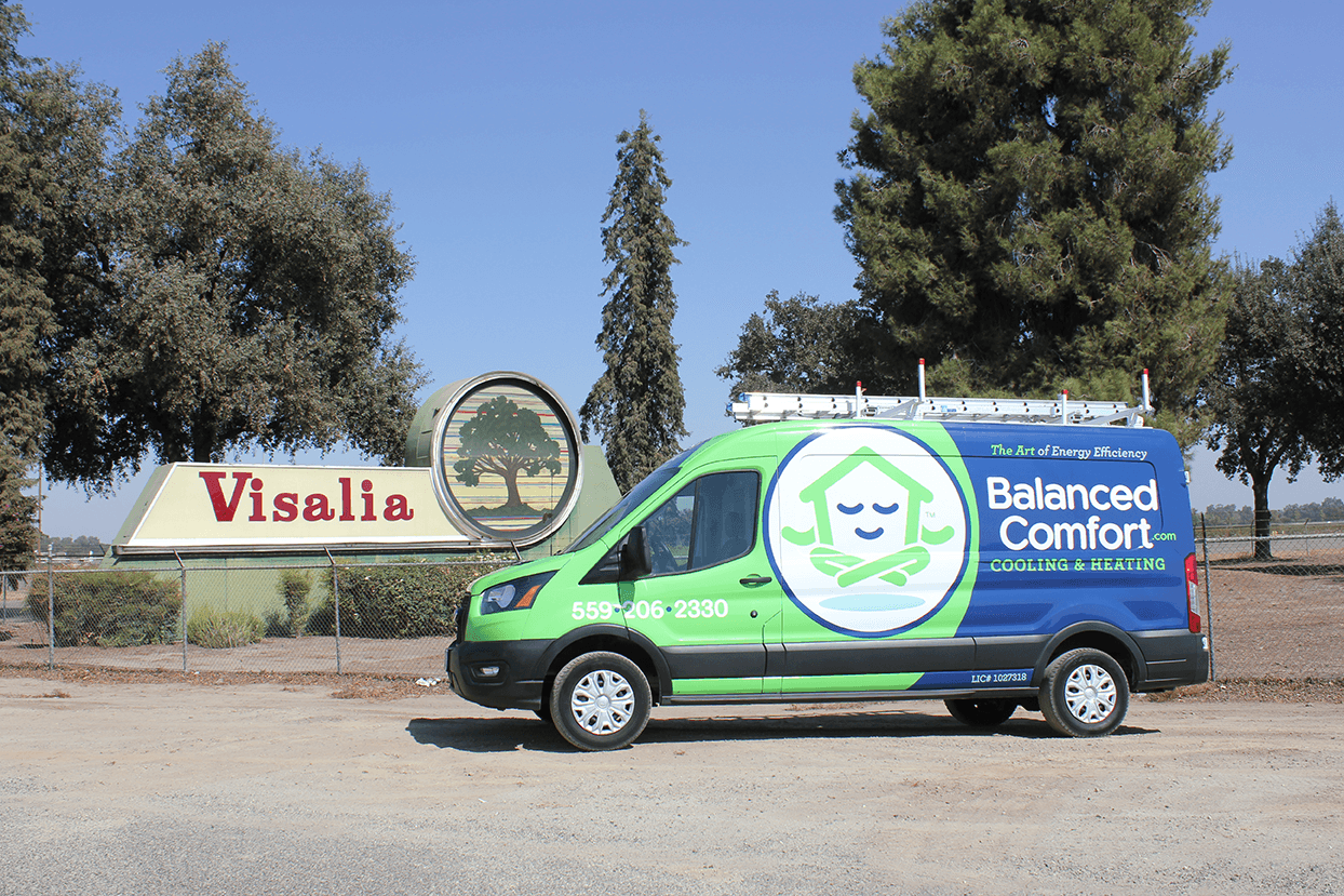 Balanced Comfort service vehicle in front of the Visalia sign