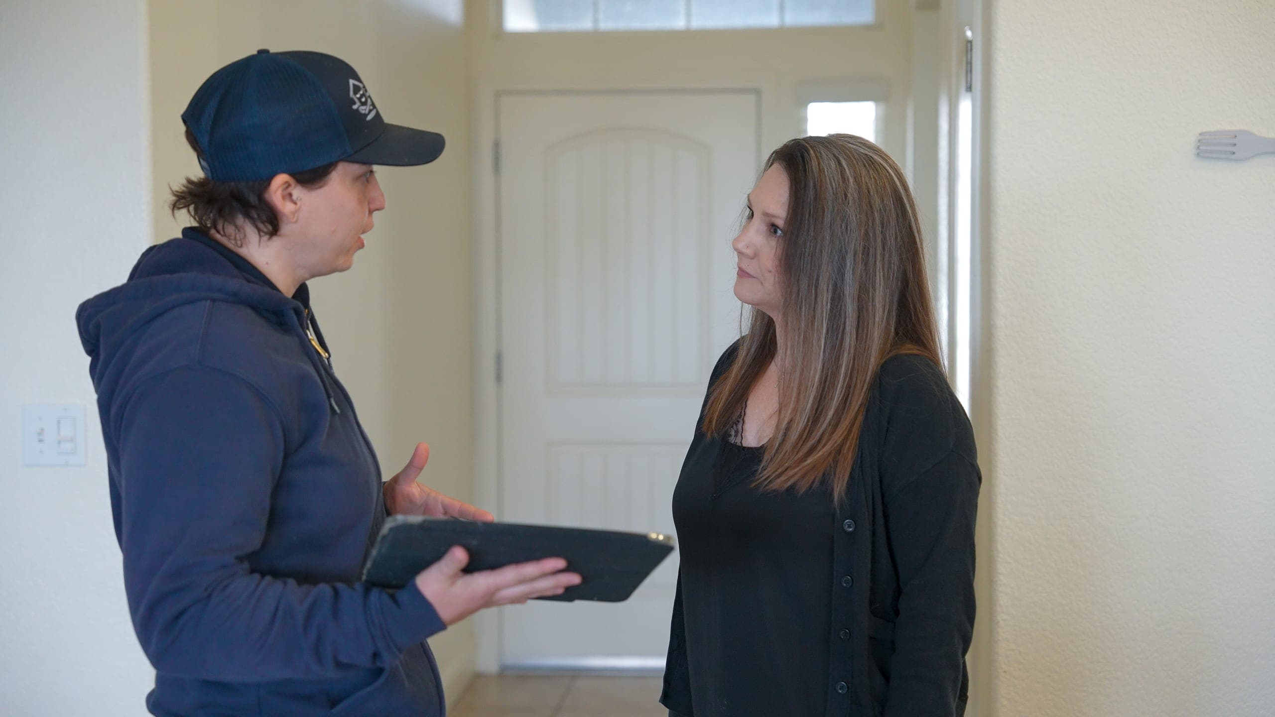 Balanced Comfort specialist reviewing new-system options with a homeowner