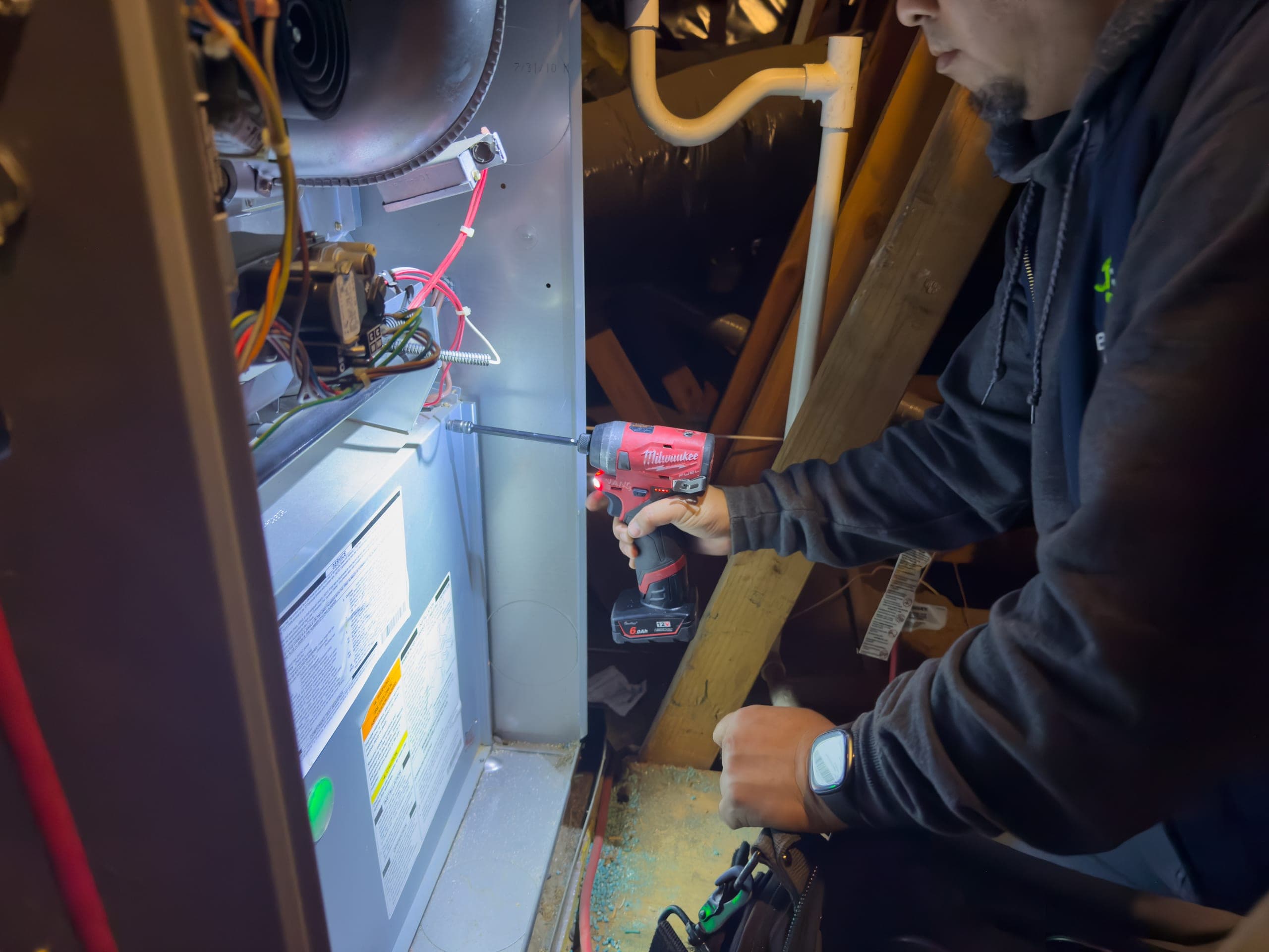 Balanced Comfort technician installing a new heating system