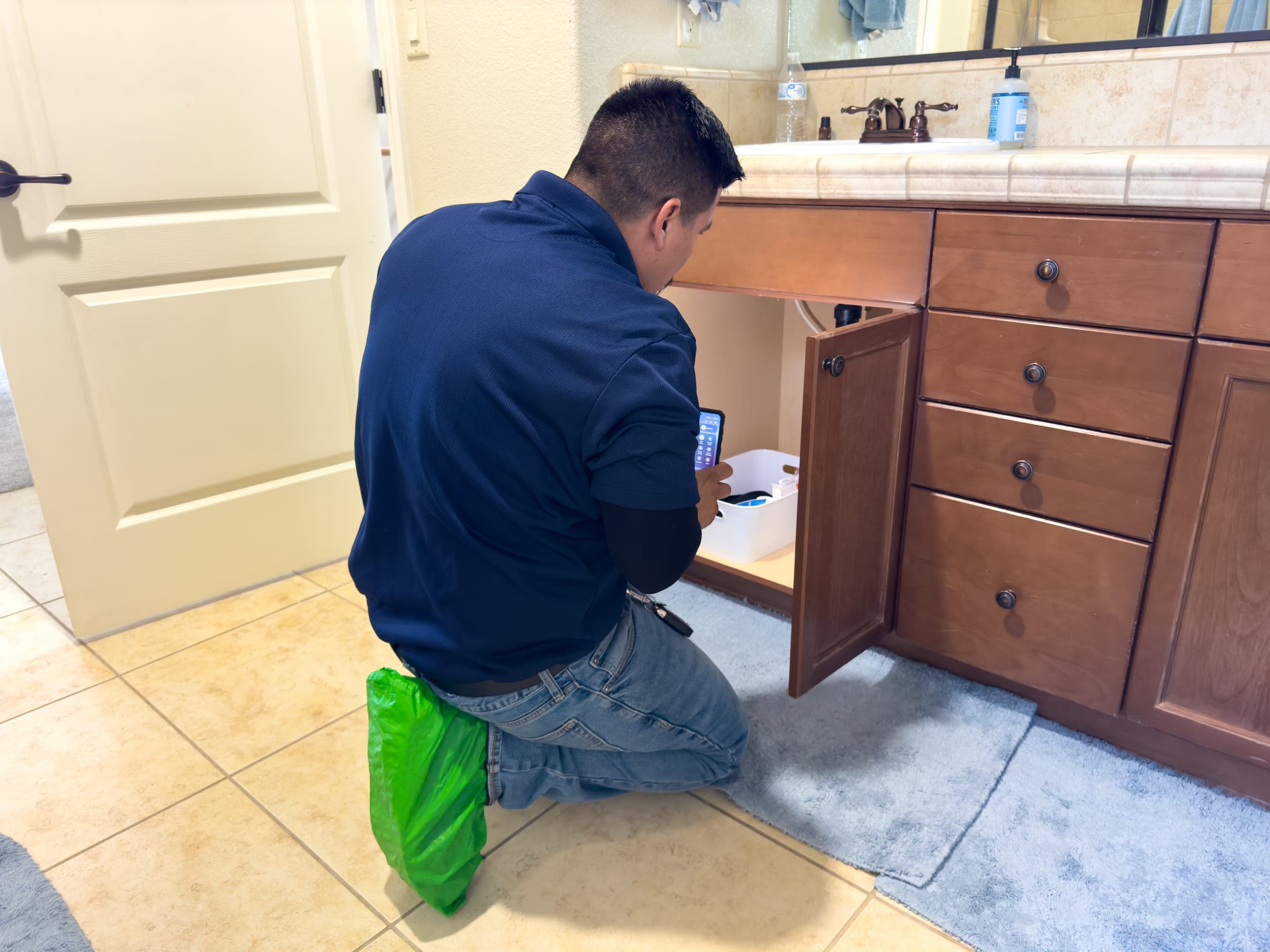Balanced Comfort technician installing a commercial water filtration system