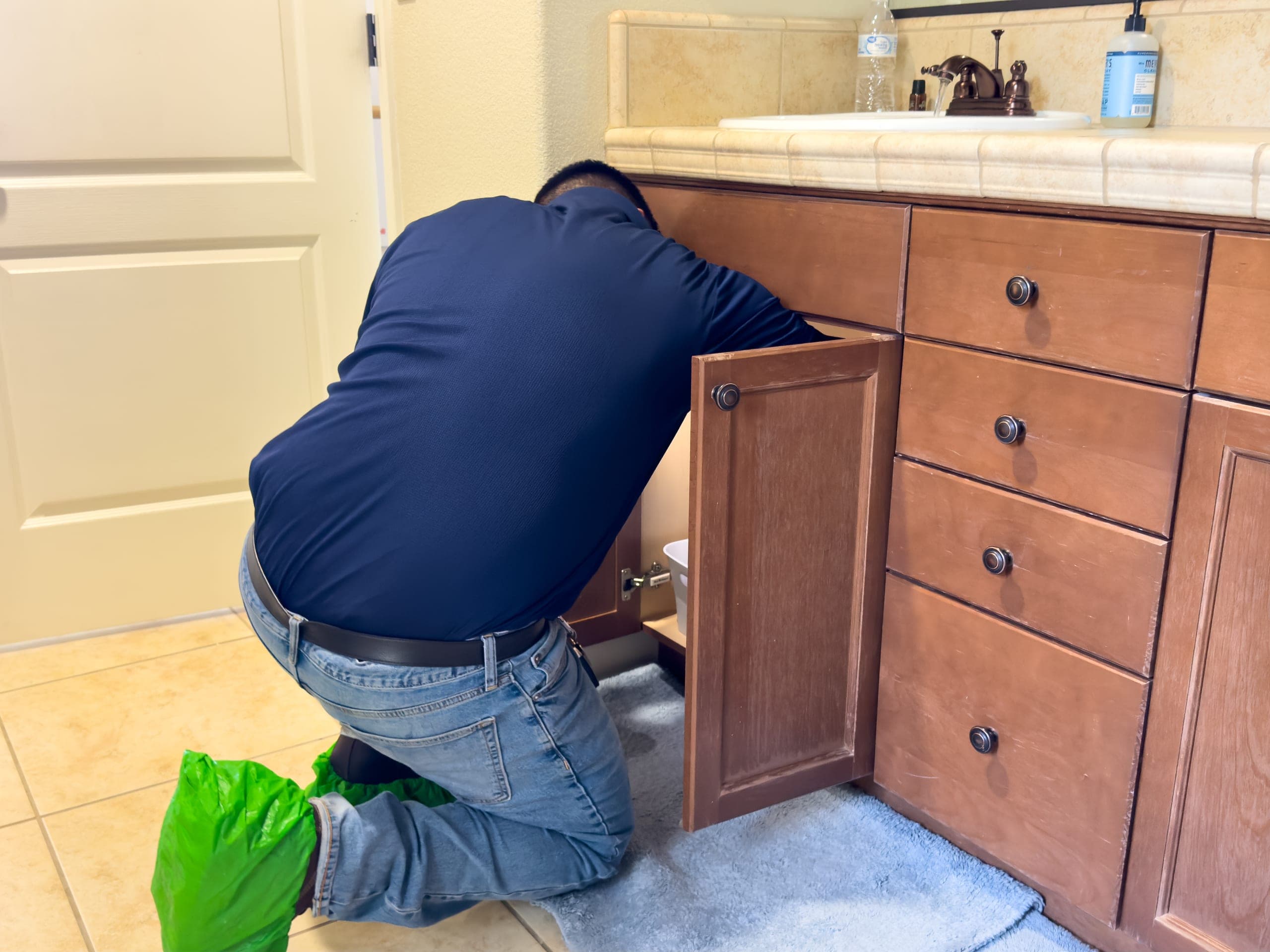 Balanced Comfort plumber inspecting a home's plumbing for a real estate transaction