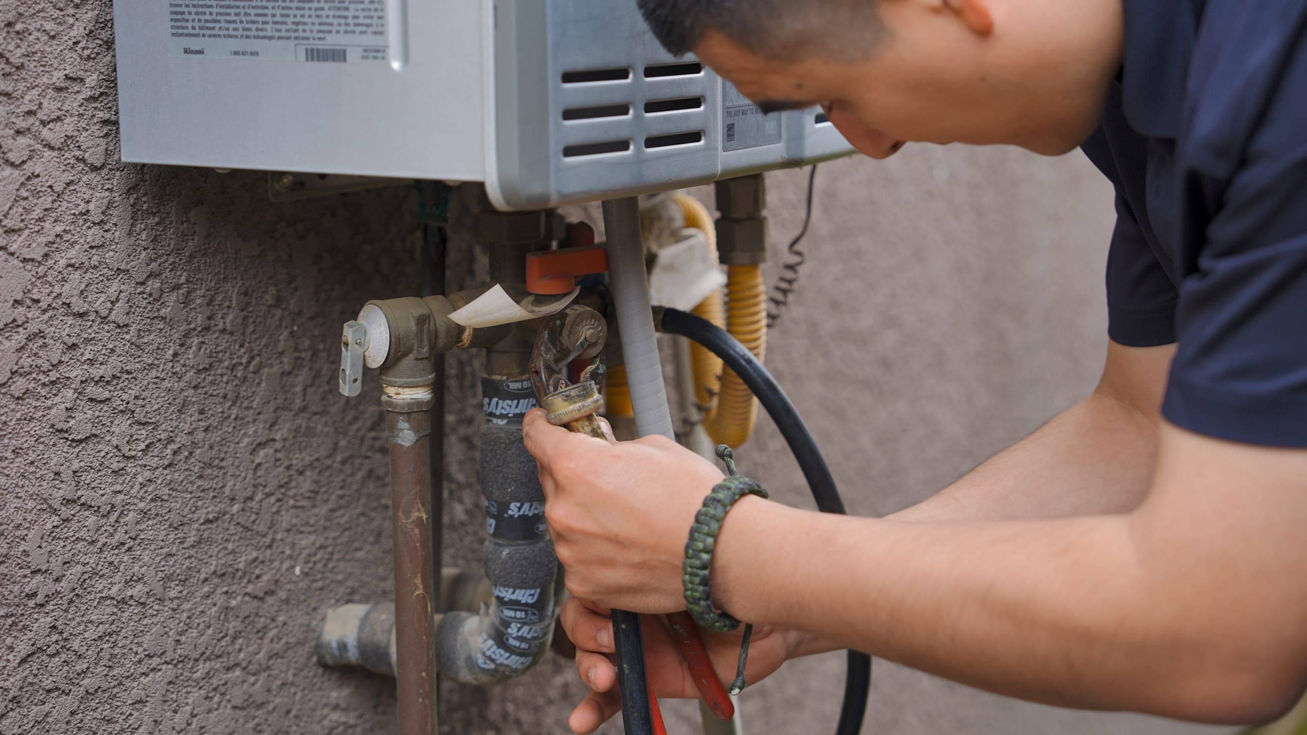 Balanced Comfort plumber installing commercial plumbing equipment