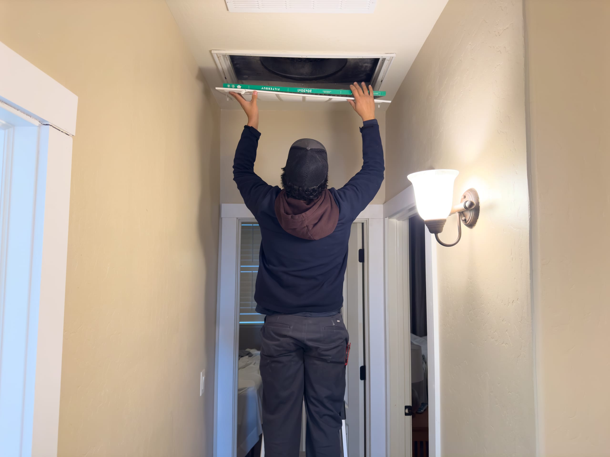 Balanced Comfort technician replacing air filter