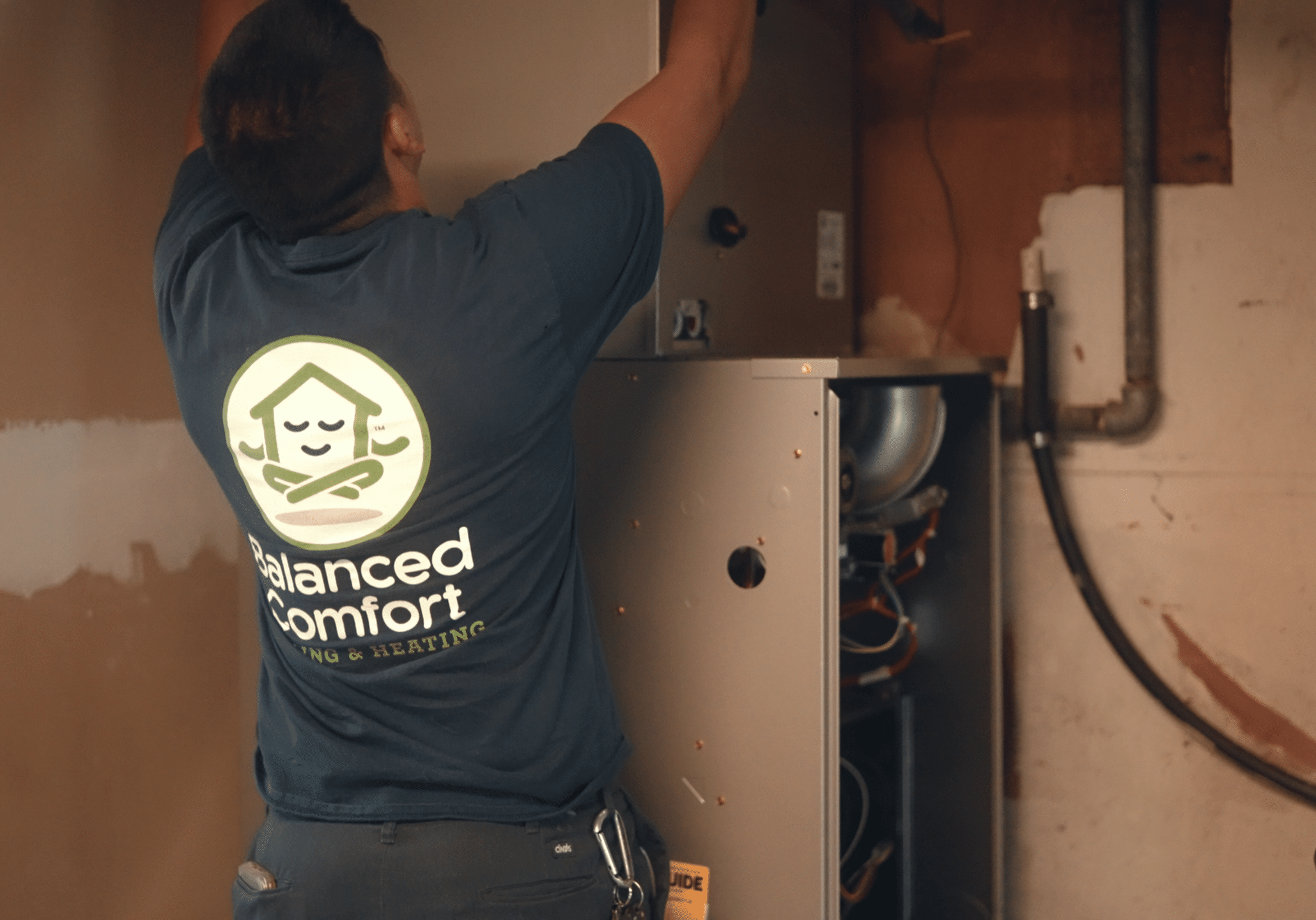 The most reliable heating contractor in Fresno California working on a furnace